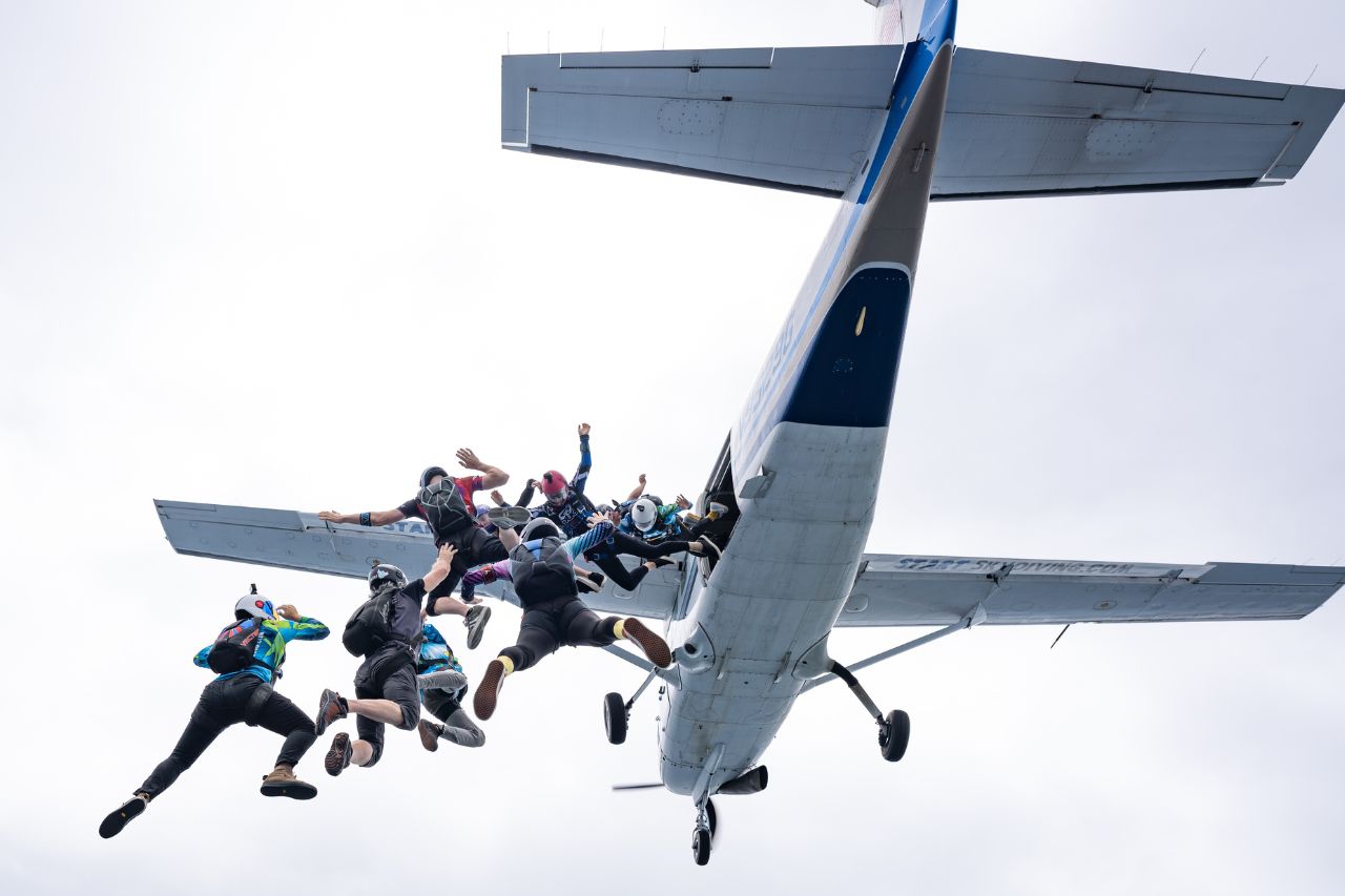 Group of fun jumpers leaping from the plane.