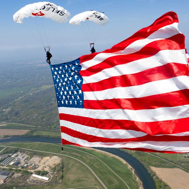 Two members of Team Fastrax fly a demonstration jump with a 5,000 square foot American flag