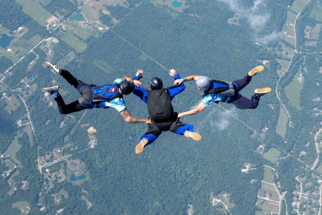 Accelerated Freefall Student with an AFF Instructor on either side to maintain stability in freefall