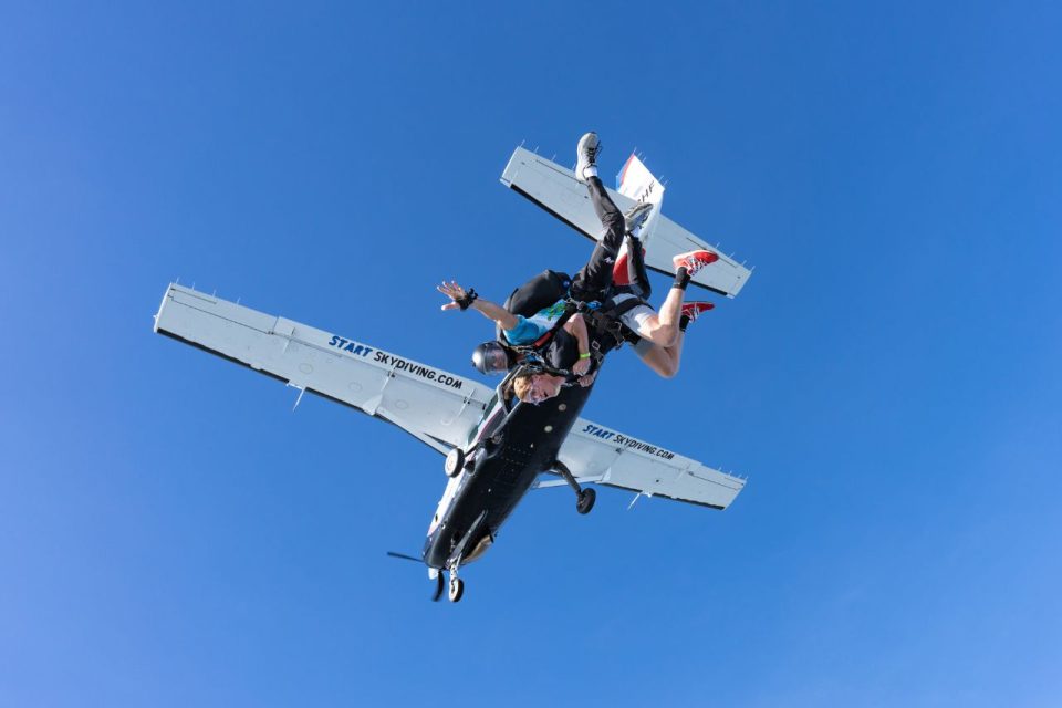 Tandem jumpers in freefall just following exiting the airplane.