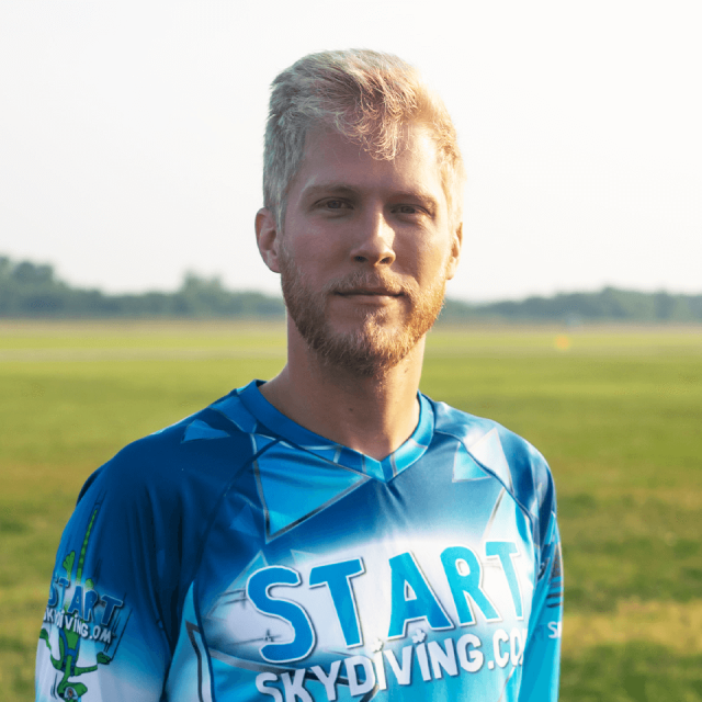 Blonde male with reddish beard wearing Start Skydiving jersey named Thomas Birdwell
